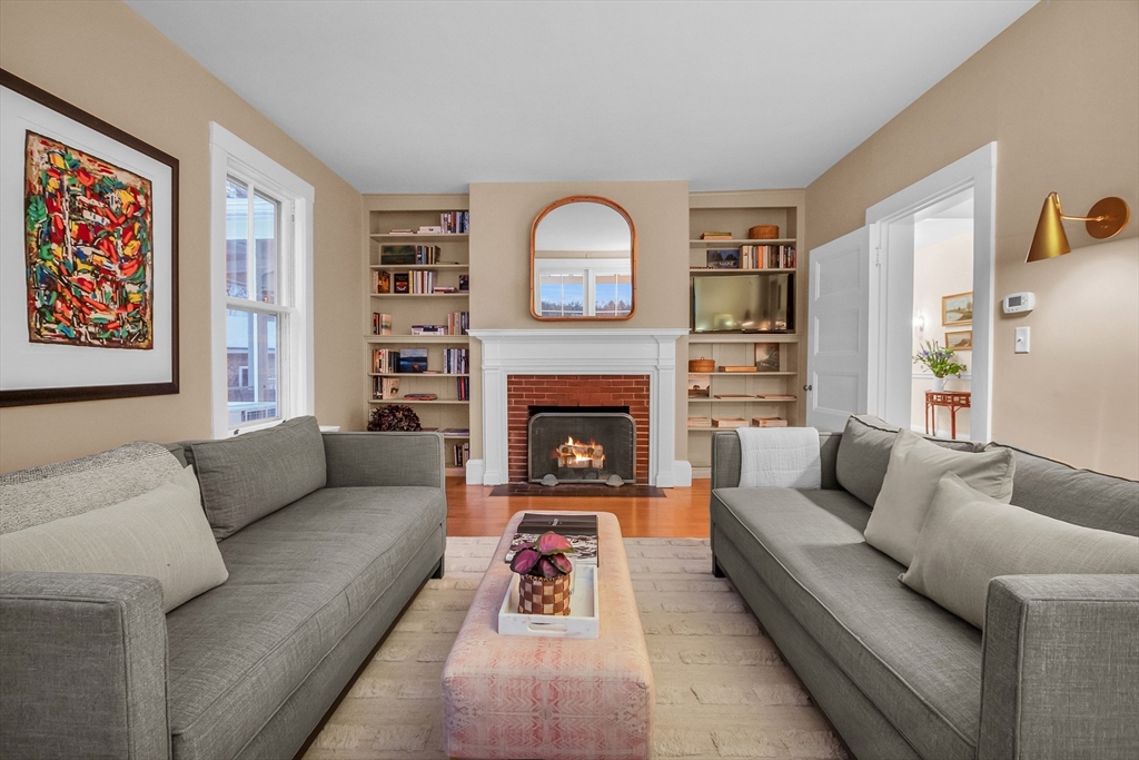 93 Coolidge Road Concord, MA 01742 - Photo 16 of 42 a living room with furniture and a fireplace