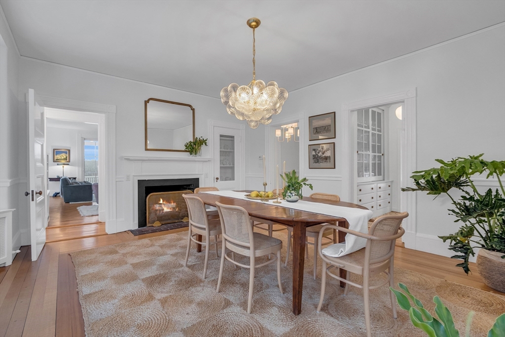93 Coolidge Road Concord, MA 01742 - Photo 20 of 42 a view of a dining room with furniture and chandelier
