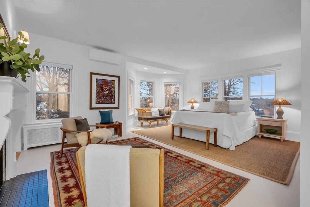 93 Coolidge Road Concord, MA 01742 - Photo 23 of 42 a bedroom with furniture and a couch