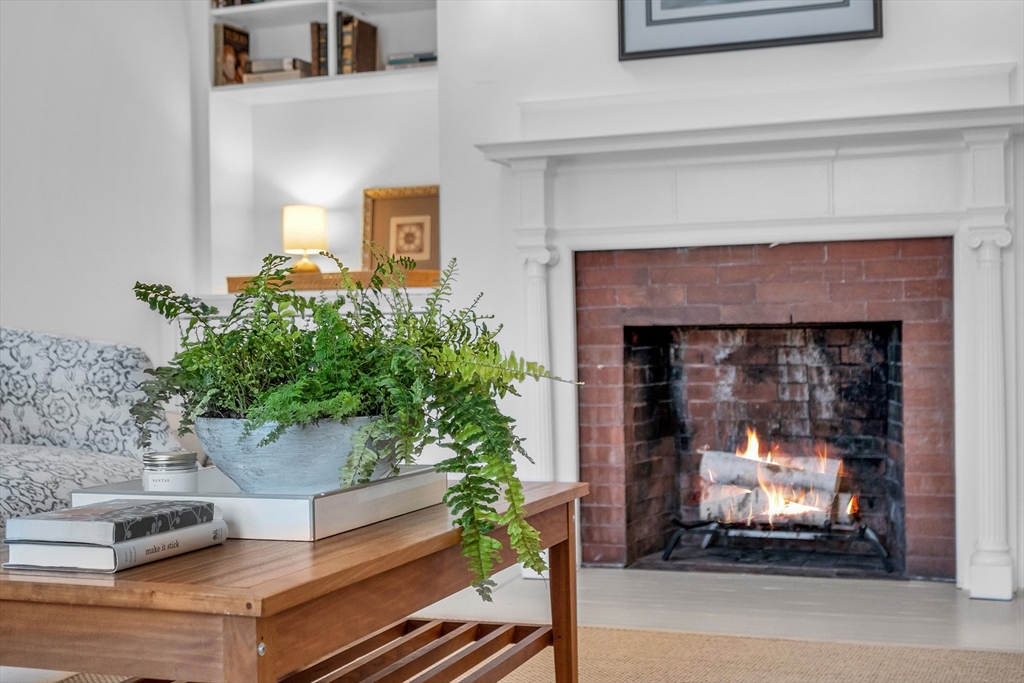 93 Coolidge Road Concord, MA 01742 - Photo 33 of 42 a living room with furniture and a fireplace