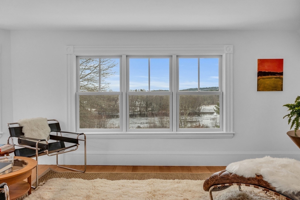93 Coolidge Road Concord, MA 01742 - Photo 36 of 42 a living room with furniture and a window