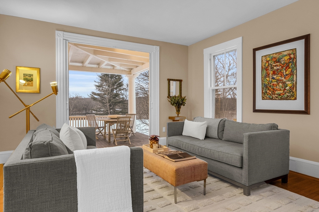 93 Coolidge Road Concord, MA 01742 - Photo 4 of 42 a living room with furniture and a large window