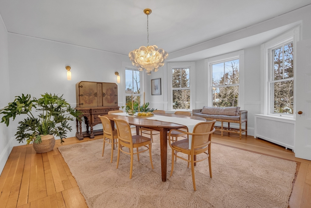 93 Coolidge Road Concord, MA 01742 - Photo 5 of 42 a view of a dining room with furniture window and wooden floor