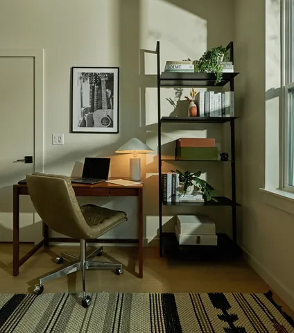 a work room with furniture and wooden floor