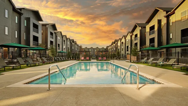 a view of a swimming pool with a lounge chairs