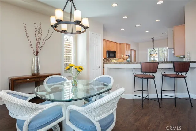 a dining room with furniture and window