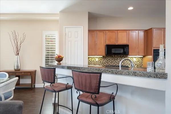 a kitchen with a dining table and chairs