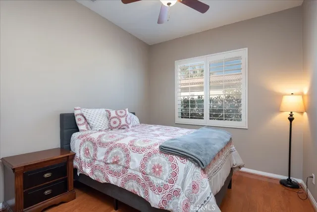 a bedroom with a bed and a tv