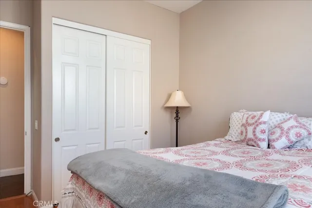 a bedroom with a bed and a dresser