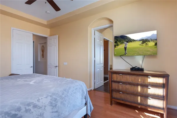 a bedroom with a bed and a dresser