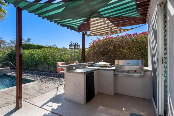 a view of a kitchen with a sink and dishwasher