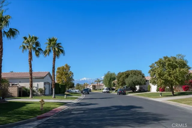 a view of a swimming pool with a table and chairs