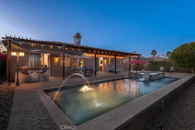 a view of a swimming pool with a patio