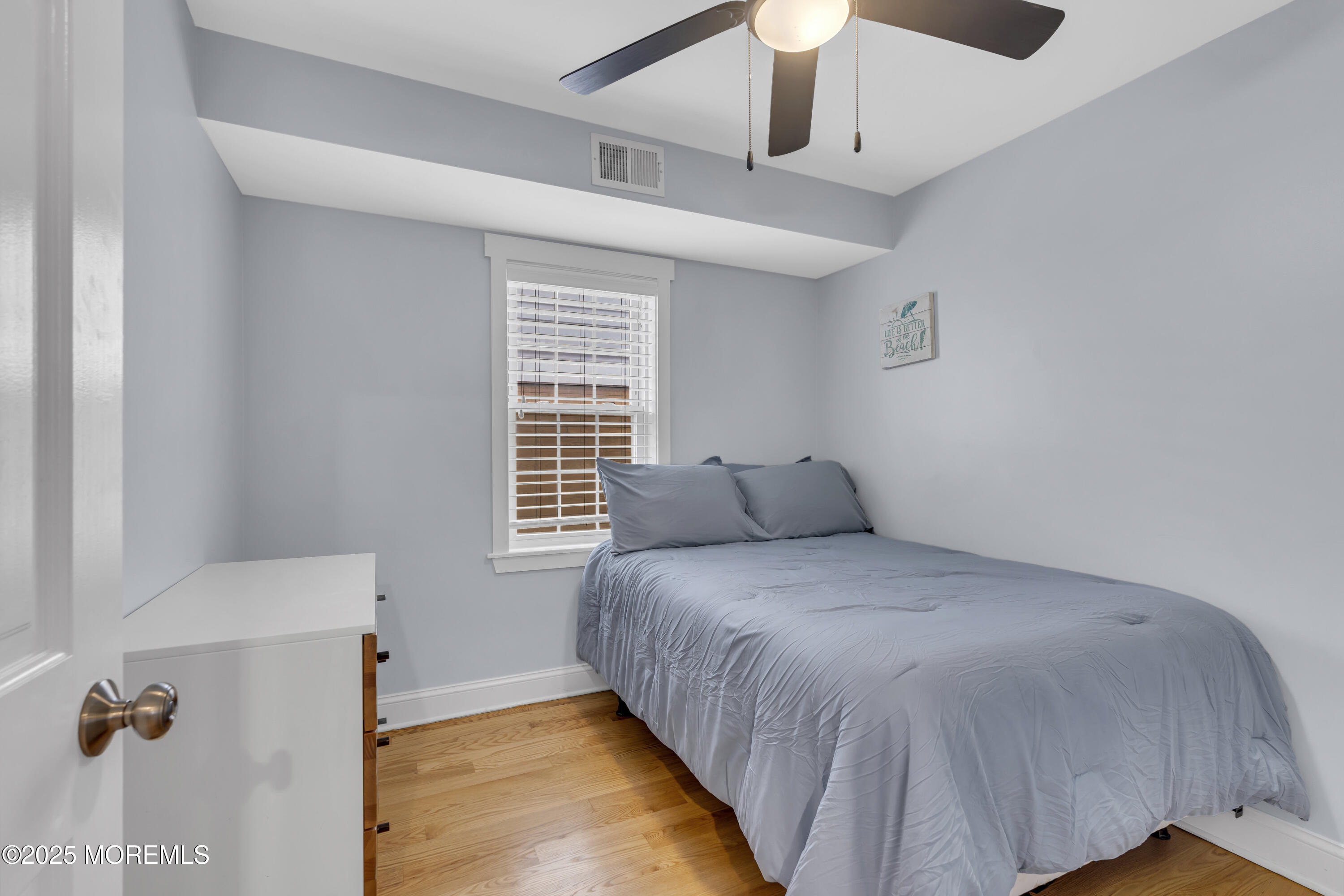 196 3rd Avenue Manasquan, NJ 08736 - Photo 16 of 36 a bedroom with a bed and a window