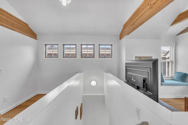 a view of a livingroom with wooden floor