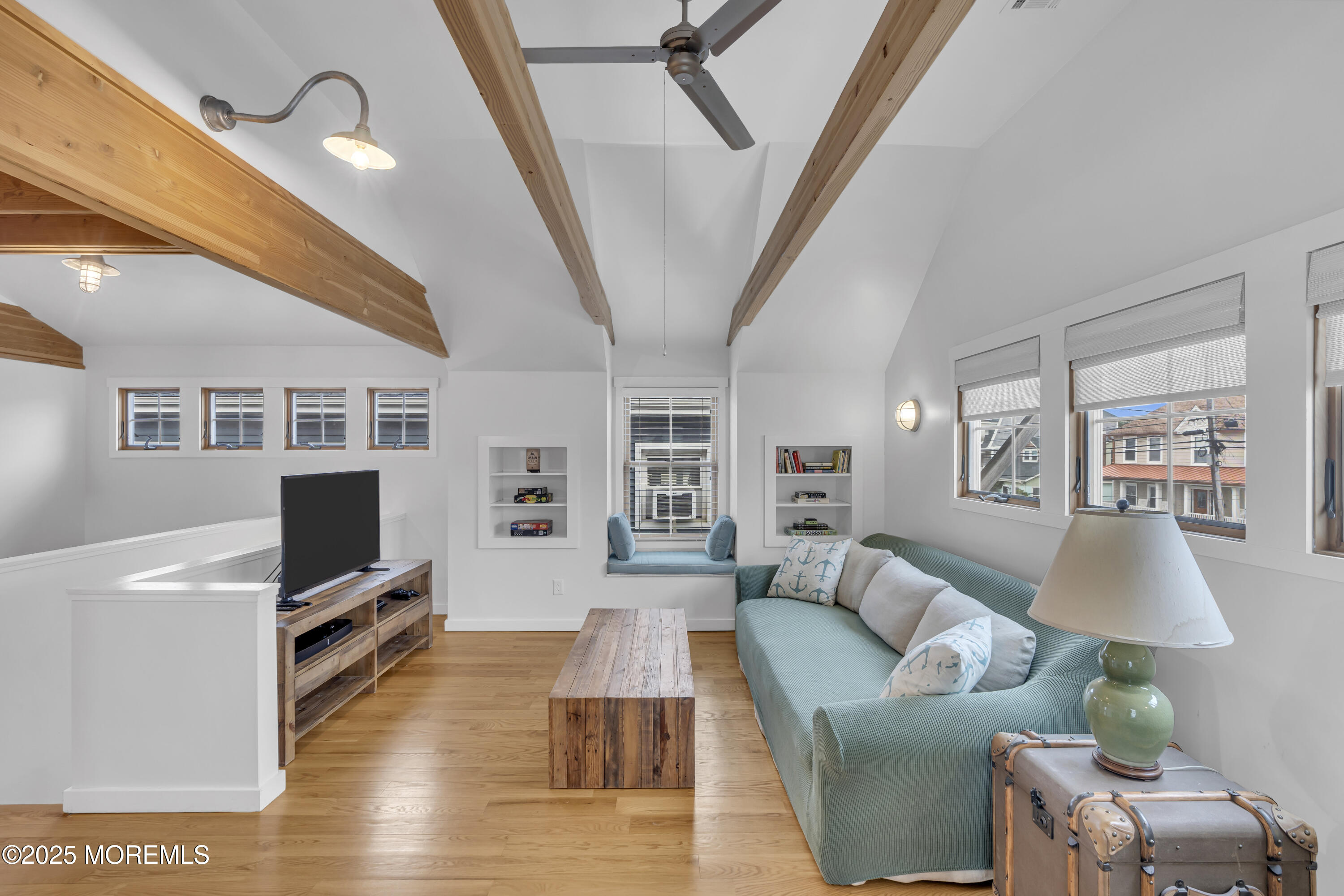 196 3rd Avenue Manasquan, NJ 08736 - Photo 19 of 36 a living room with furniture and a flat screen tv