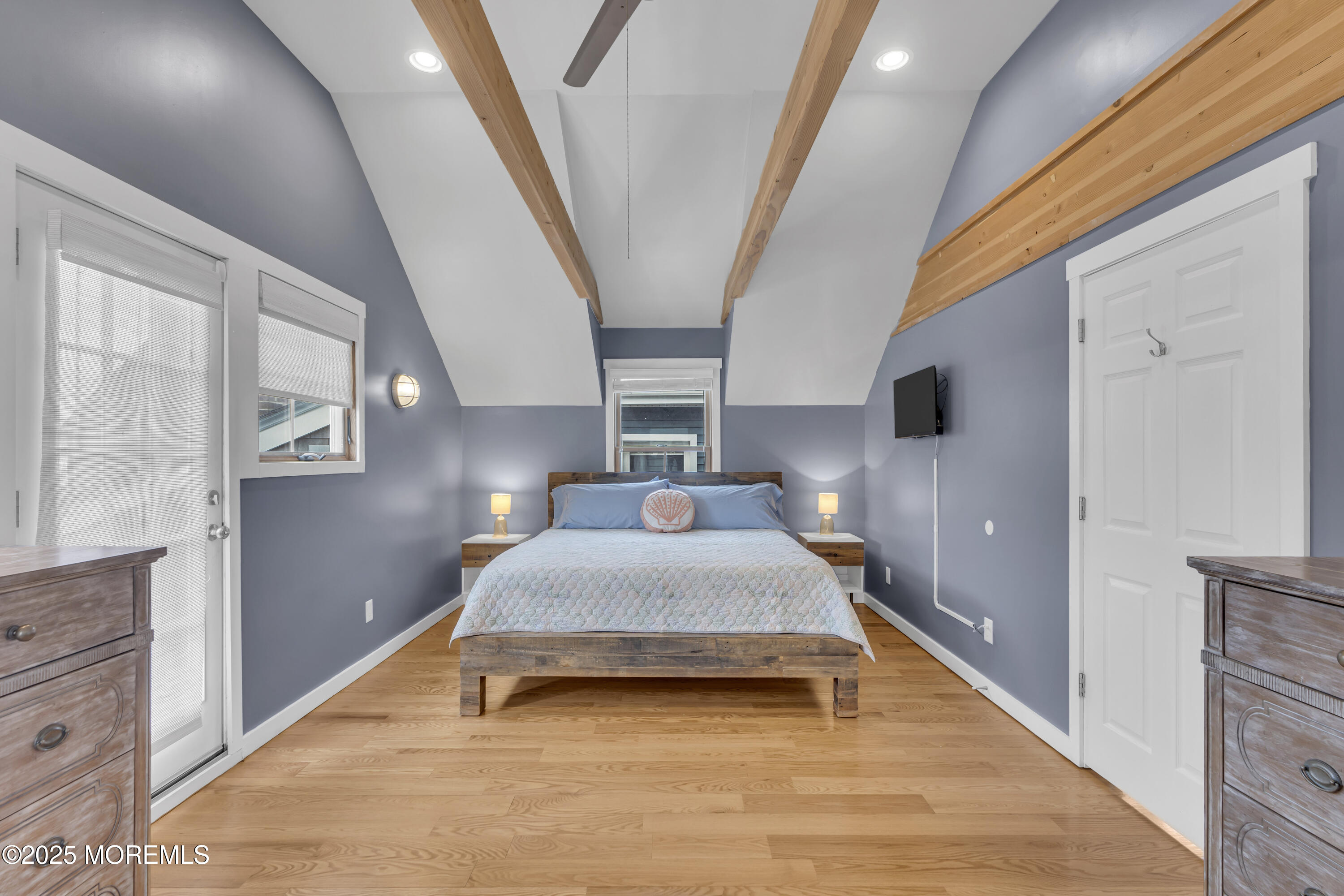 196 3rd Avenue Manasquan, NJ 08736 - Photo 21 of 36 a spacious bedroom with a bed and wooden floor