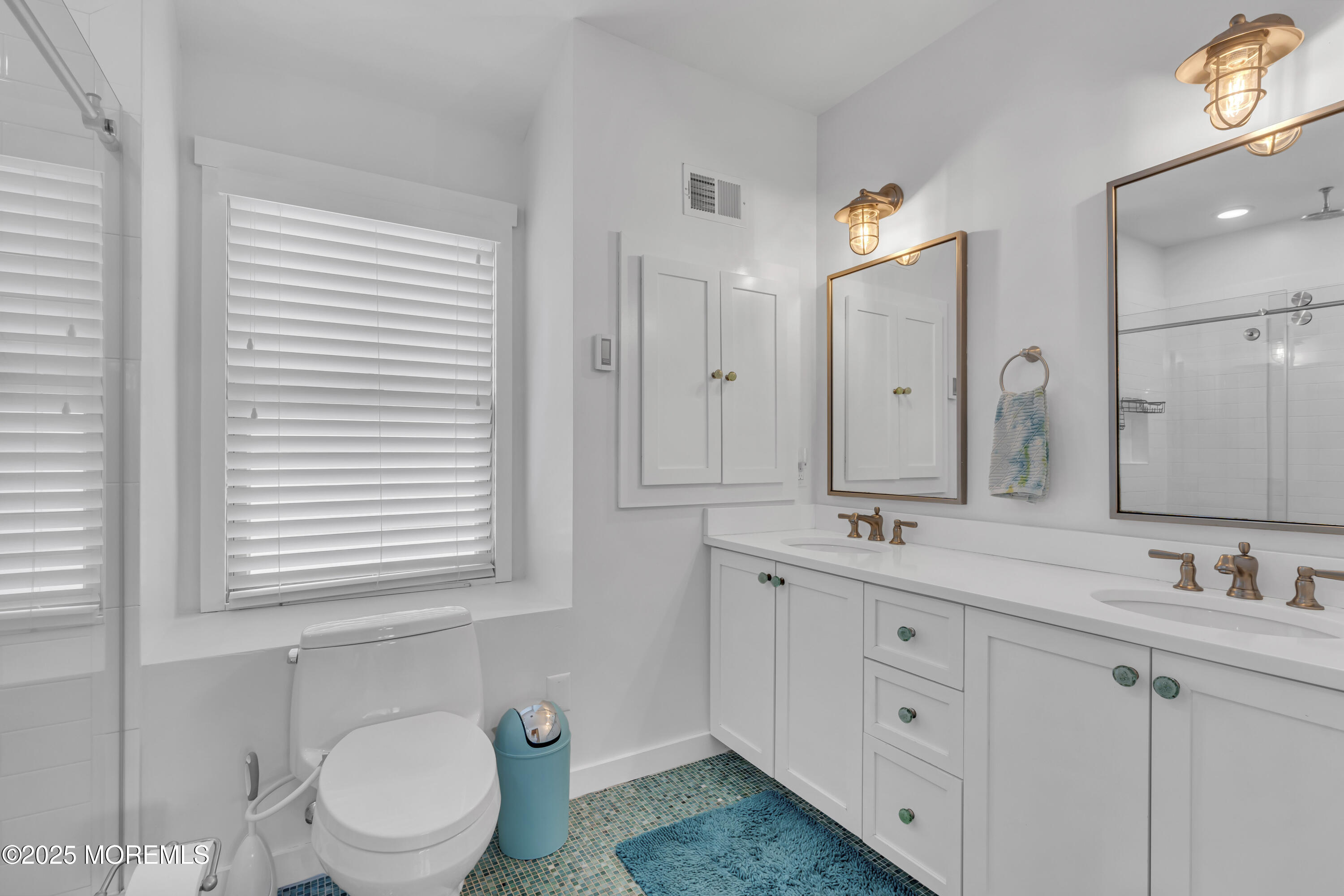 196 3rd Avenue Manasquan, NJ 08736 - Photo 23 of 36 a bathroom with a double vanity sink toilet and a mirror