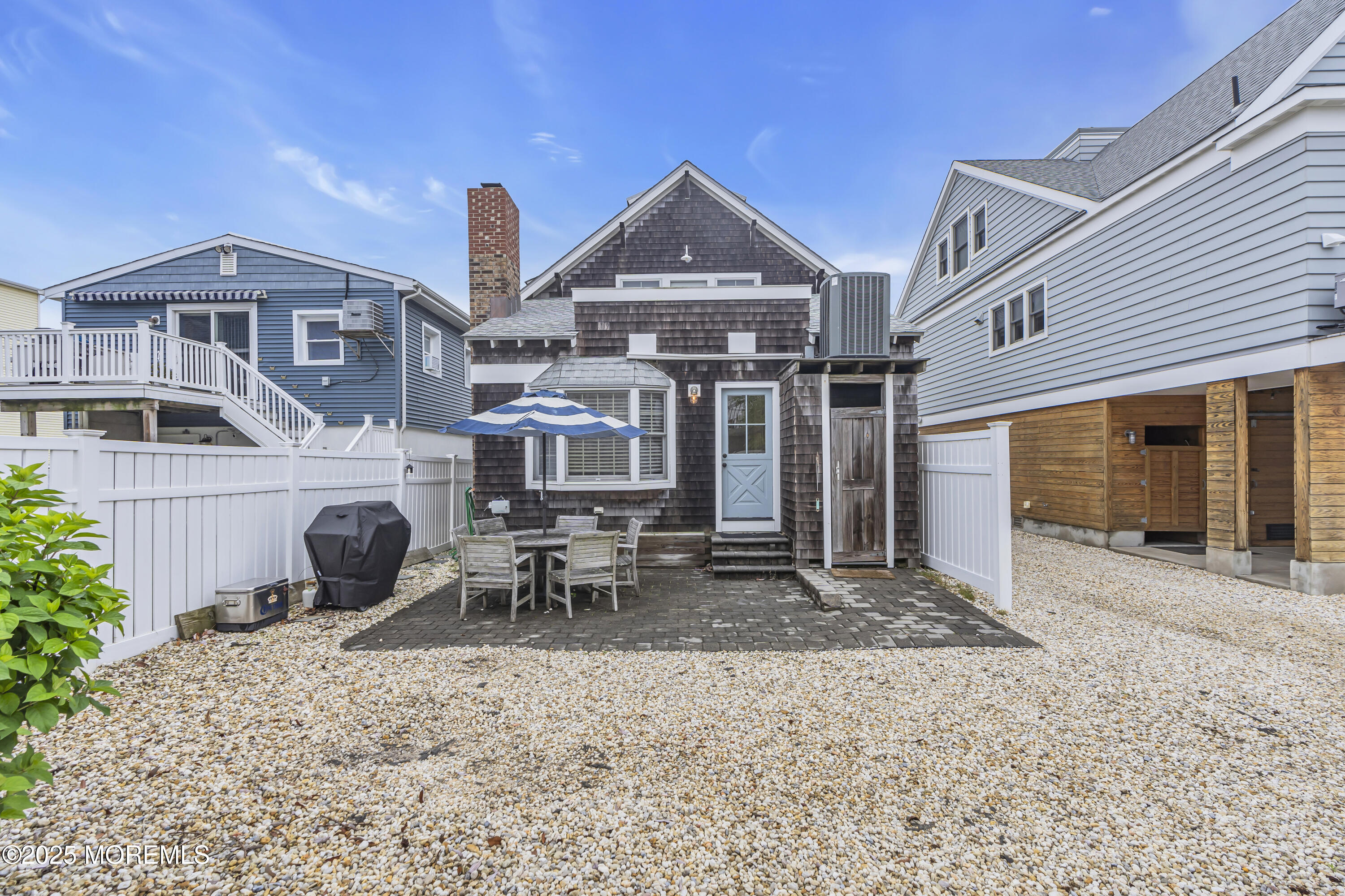 196 3rd Avenue Manasquan, NJ 08736 - Photo 26 of 36 a front view of a house with table and chairs