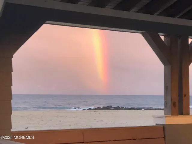 a view of wooden floor and a floor to ceiling window