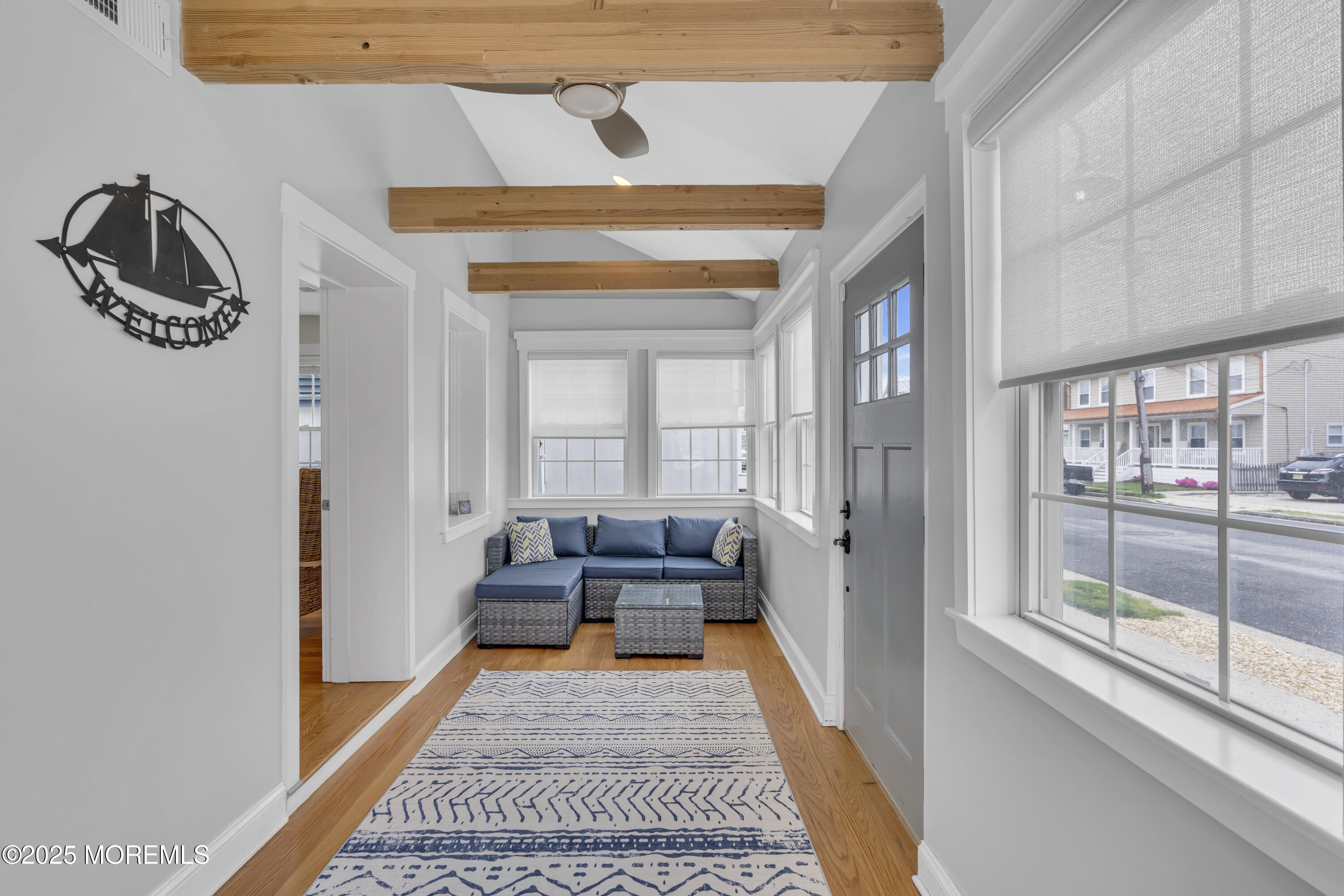 196 3rd Avenue Manasquan, NJ 08736 - Photo 3 of 36 a hallway with a couch and a rug