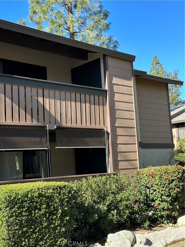20702 El Toro Road, Unit 240 Lake Forest, CA 92630 - Photo 19 of 30 a front view of a house with a garden