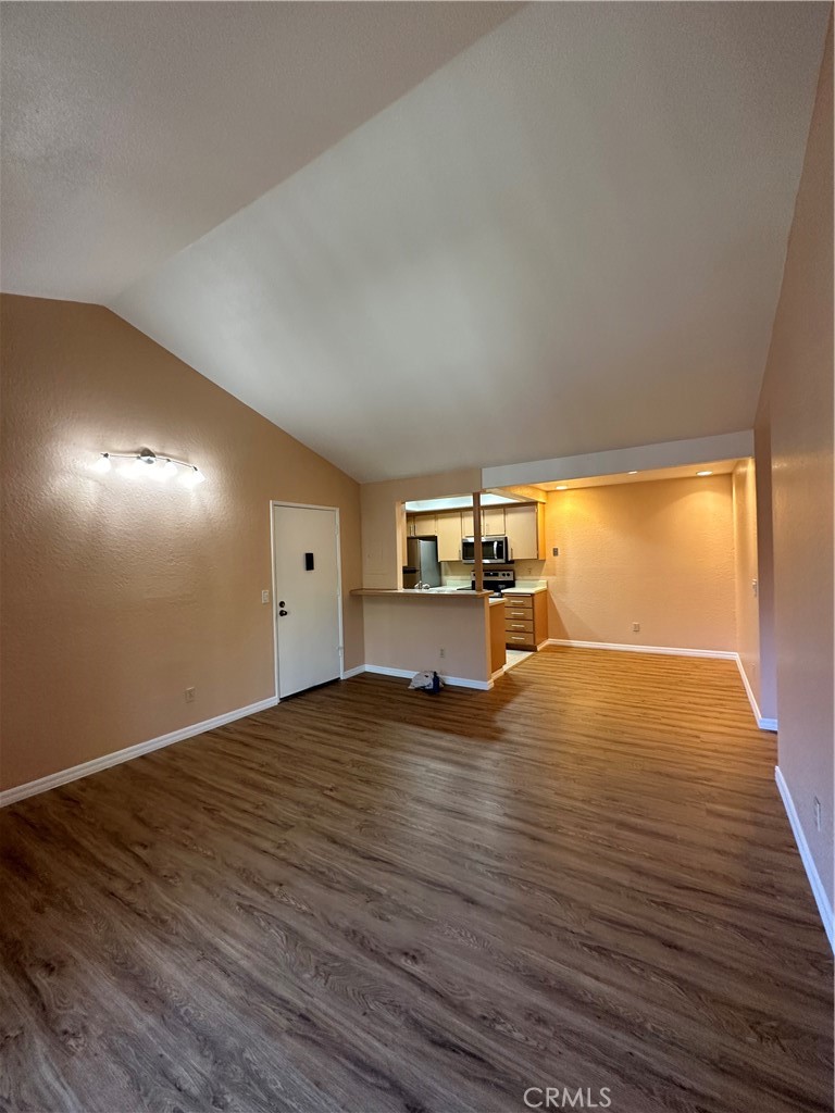 20702 El Toro Road, Unit 240 Lake Forest, CA 92630 - Photo 4 of 30 a view of empty room with wooden floor