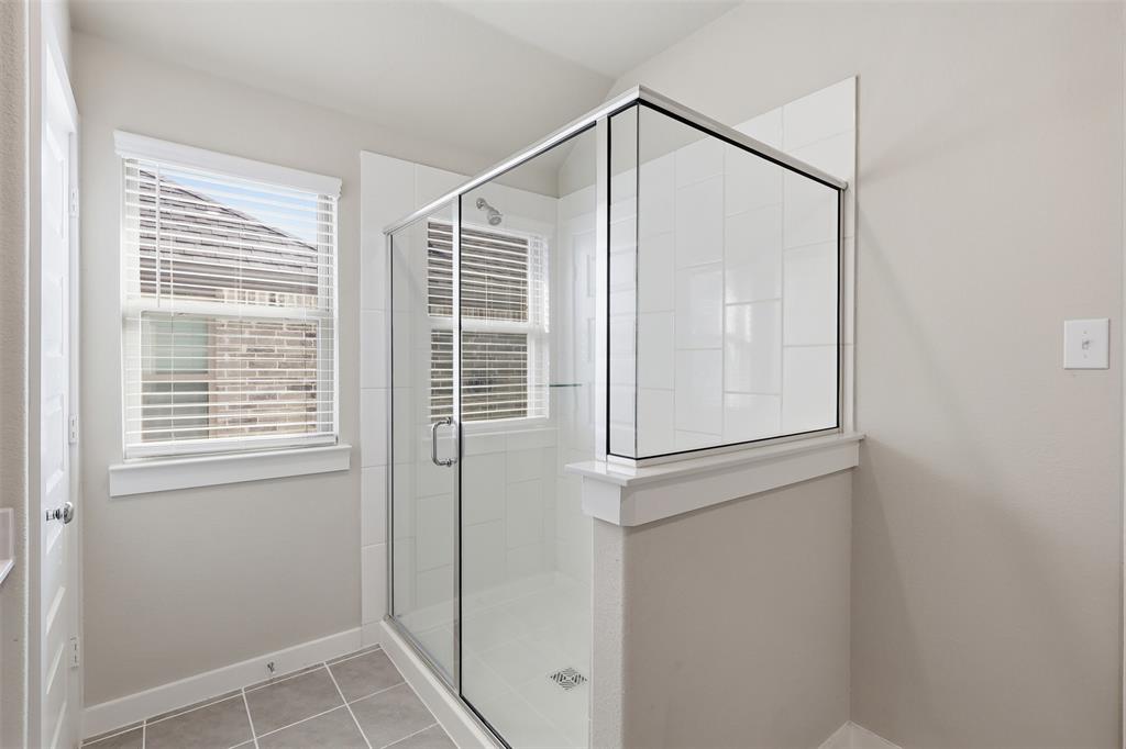 2629 Green River Road Royse City, TX 75189 - Photo 15 of 18 a bathroom with a glass shower door