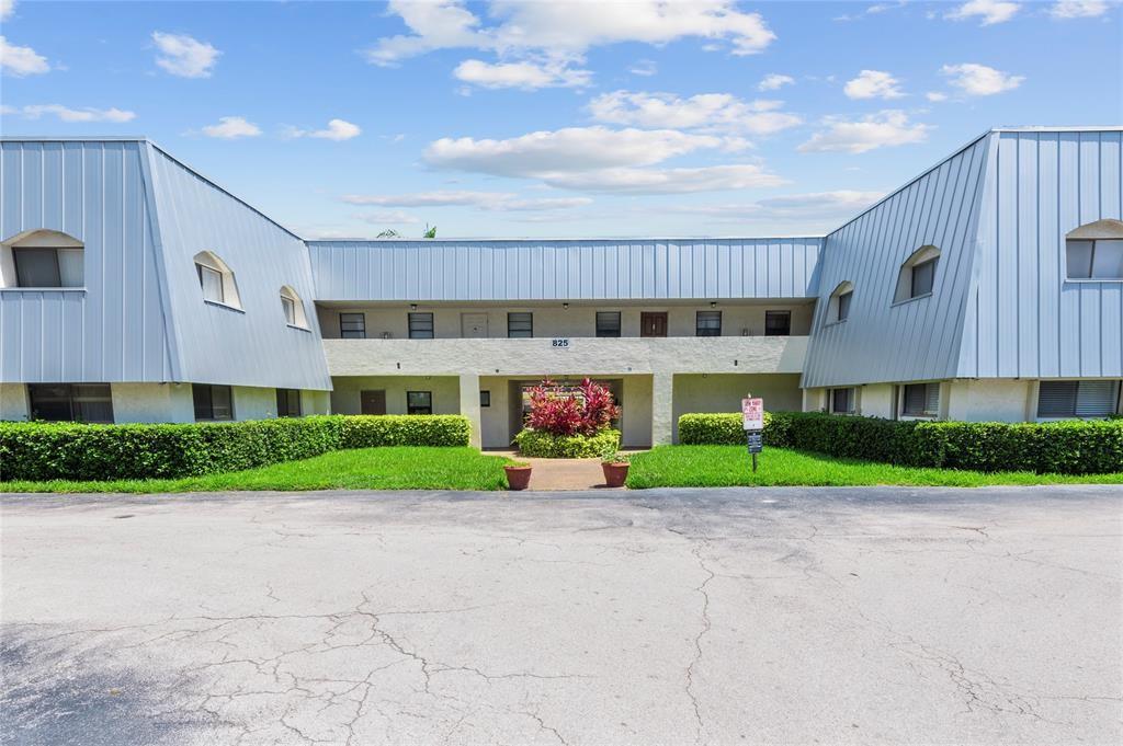 a view of a building with a street
