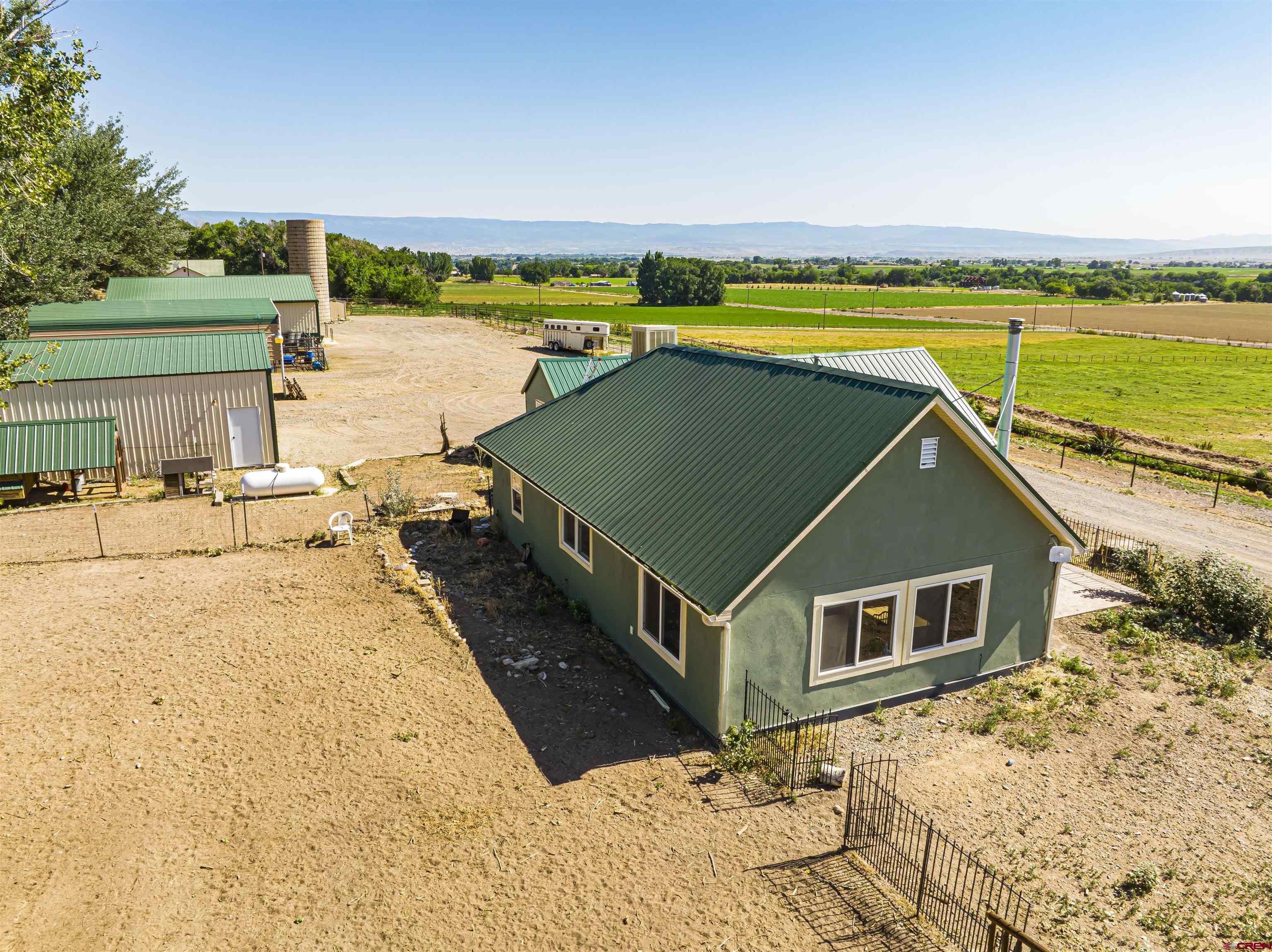 54867 Banner Road Delta, CO 81416 - Photo 3 of 33 a view of a house with a ocean view