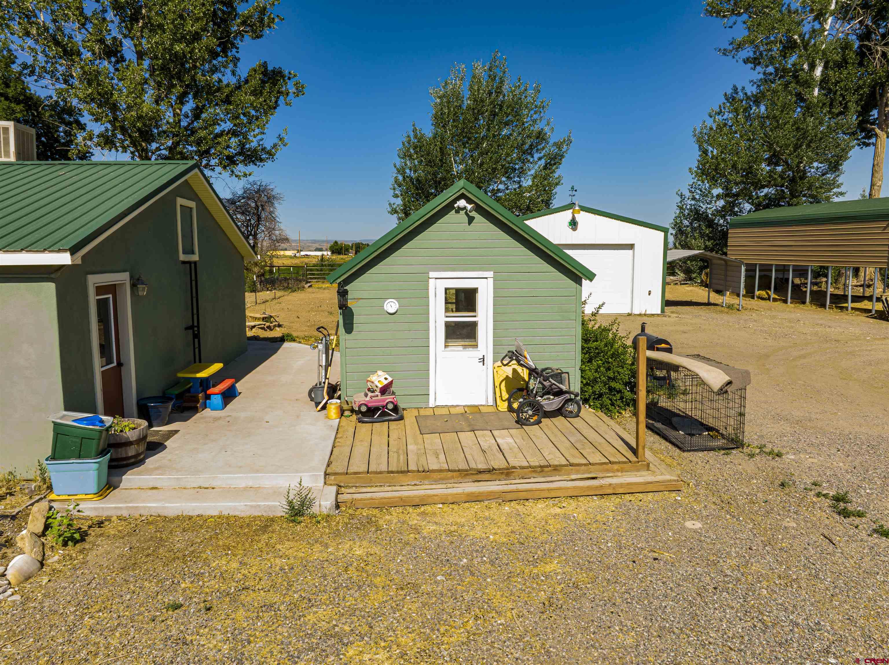 54867 Banner Road Delta, CO 81416 - Photo 7 of 33 a view of a house with backyard and a tree