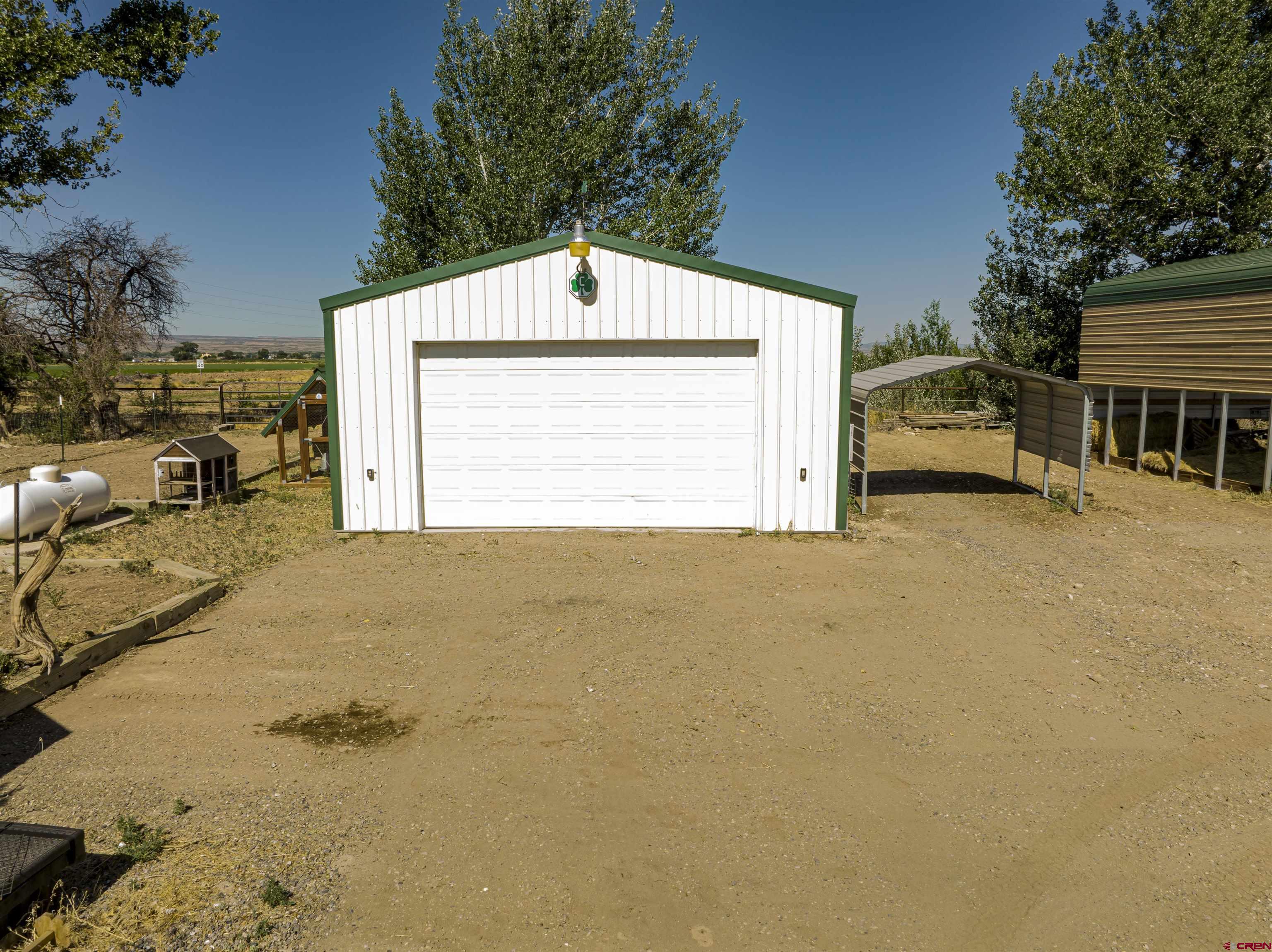 54867 Banner Road Delta, CO 81416 - Photo 8 of 33 a view of garage and yard