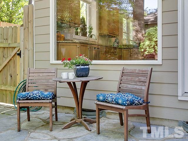 2004 Buckingham Road Raleigh, NC 27607 - Photo 11 of 25 a view of a chairs and table in a patio
