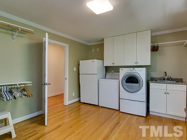 2004 Buckingham Road Raleigh, NC 27607 - Photo 15 of 25 a view of a storage & utility room with washer and dryer