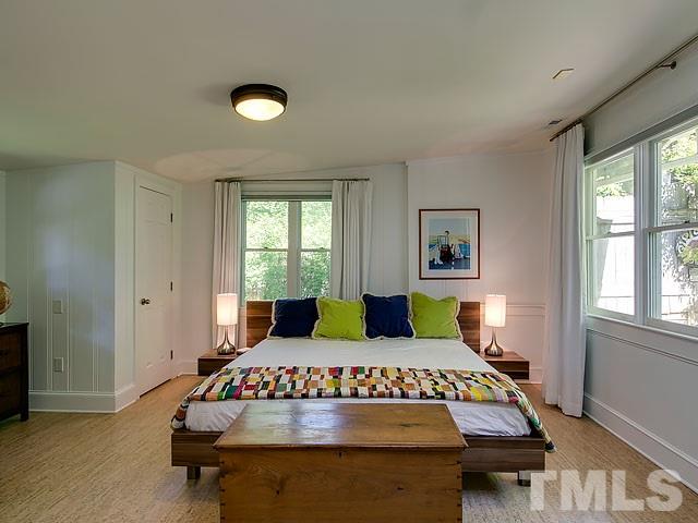 2004 Buckingham Road Raleigh, NC 27607 - Photo 17 of 25 a bedroom with a bed and a window