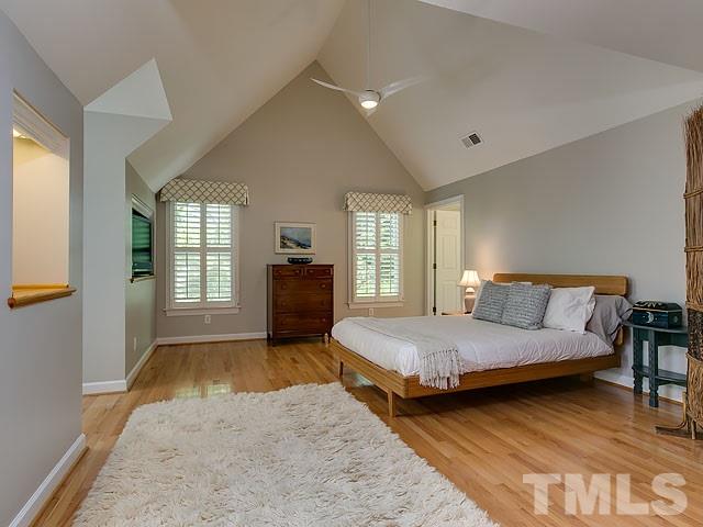 2004 Buckingham Road Raleigh, NC 27607 - Photo 18 of 25 a spacious bedroom with a bed and wooden floor