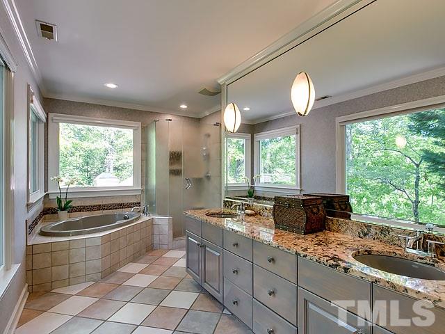 2004 Buckingham Road Raleigh, NC 27607 - Photo 19 of 25 a large kitchen with kitchen island granite countertop a stove and a sink