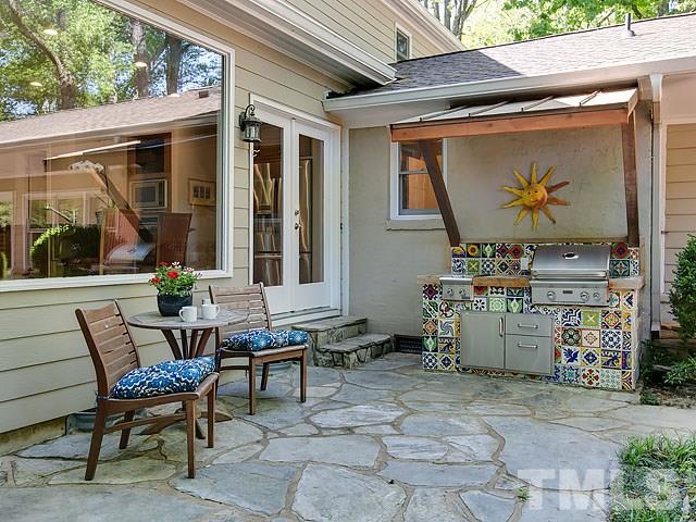 2004 Buckingham Road Raleigh, NC 27607 - Photo 25 of 25 a view of a patio with dining table and chairs