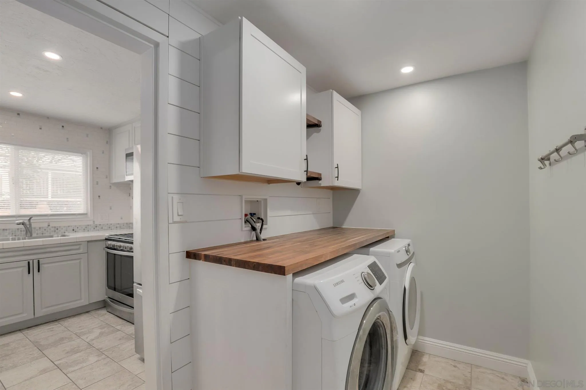 9753 Settle Road Santee, CA 92071 - Photo 11 of 31 a view of a kitchen with sink washer and dryer
