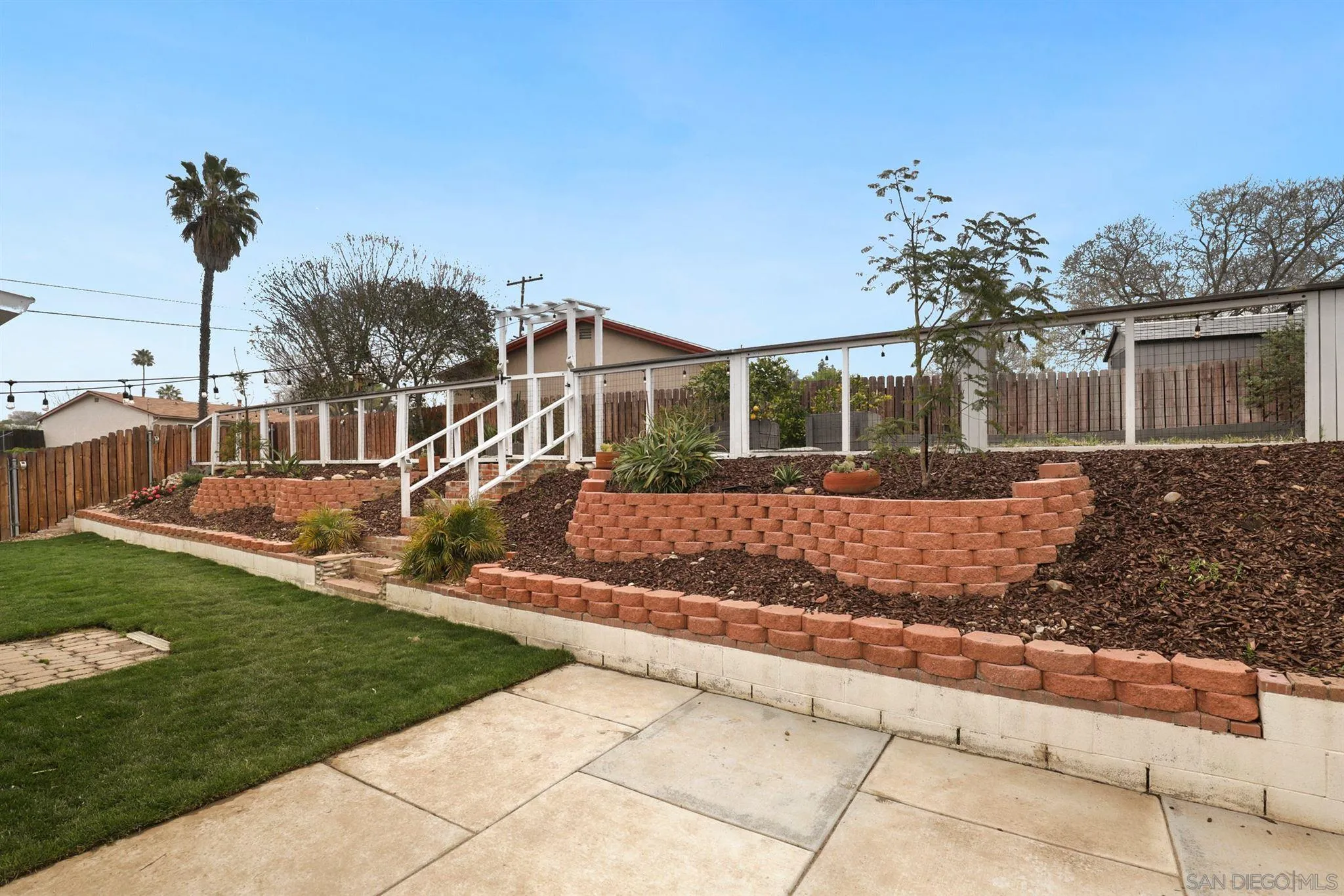 9753 Settle Road Santee, CA 92071 - Photo 24 of 31 a front view of a house with a yard