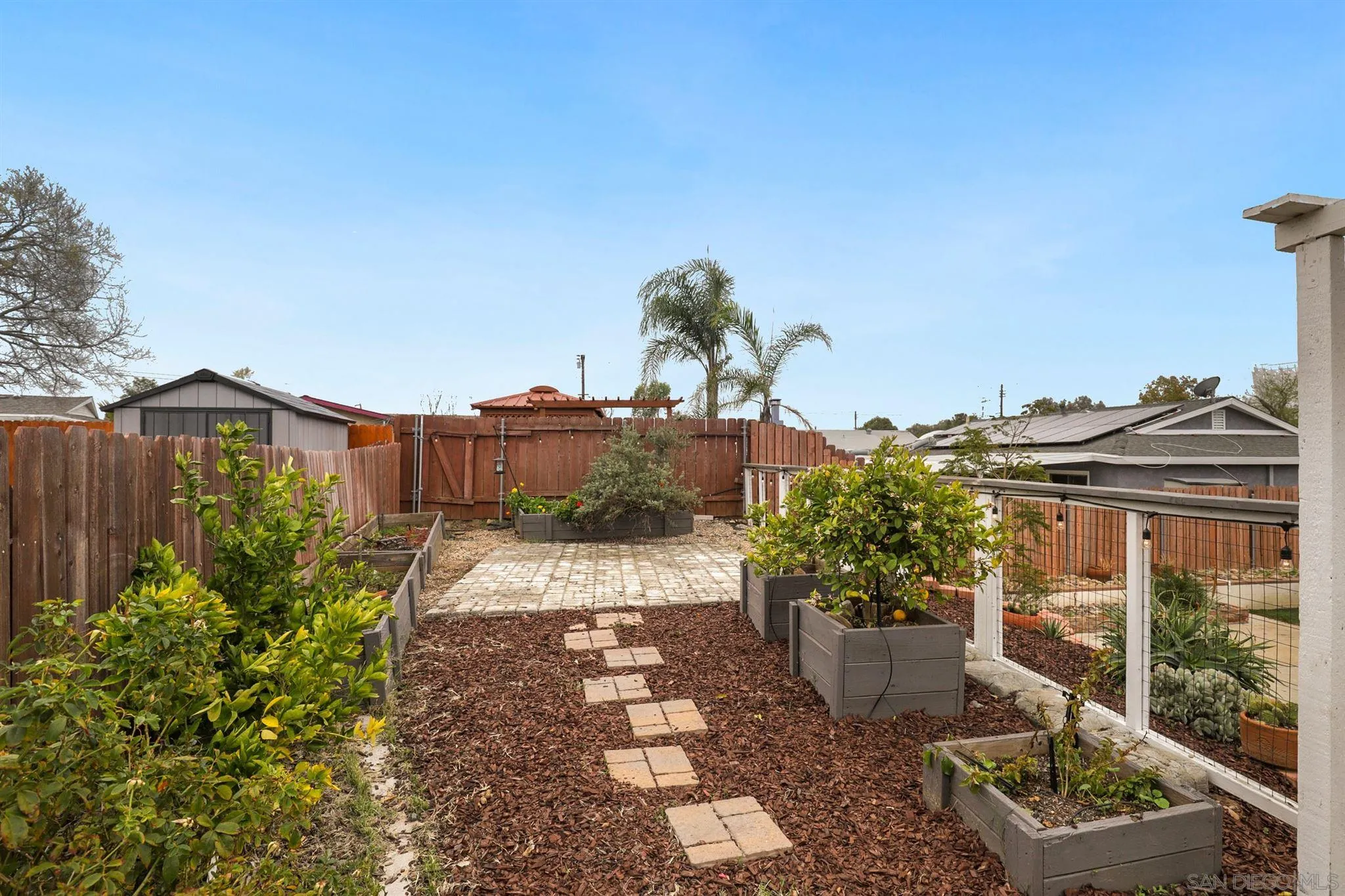 9753 Settle Road Santee, CA 92071 - Photo 26 of 31 a front view of a house with a yard