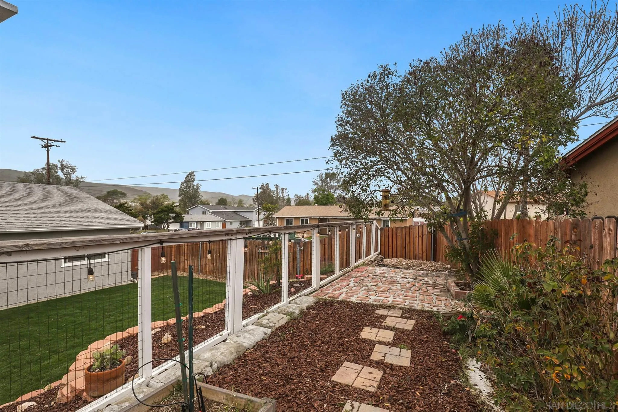 9753 Settle Road Santee, CA 92071 - Photo 27 of 31 a view of a house with backyard and porch