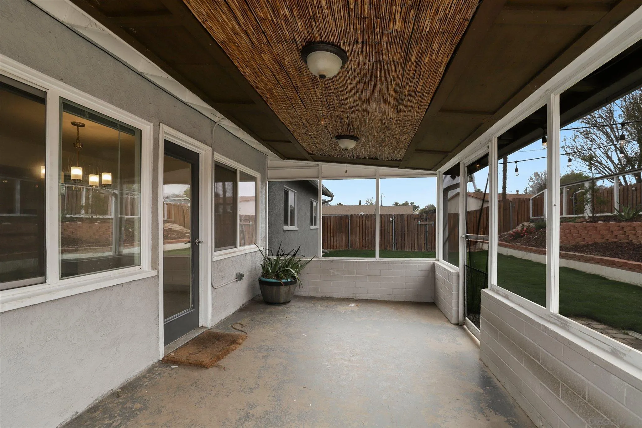 9753 Settle Road Santee, CA 92071 - Photo 29 of 31 a view of porch with furniture and floor to ceiling window