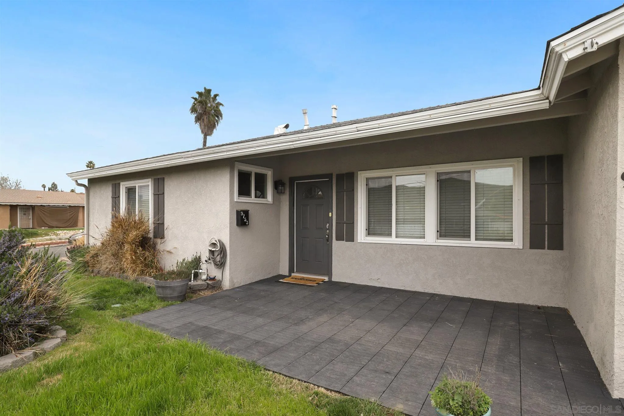 9753 Settle Road Santee, CA 92071 - Photo 30 of 31 a front view of a house with garden