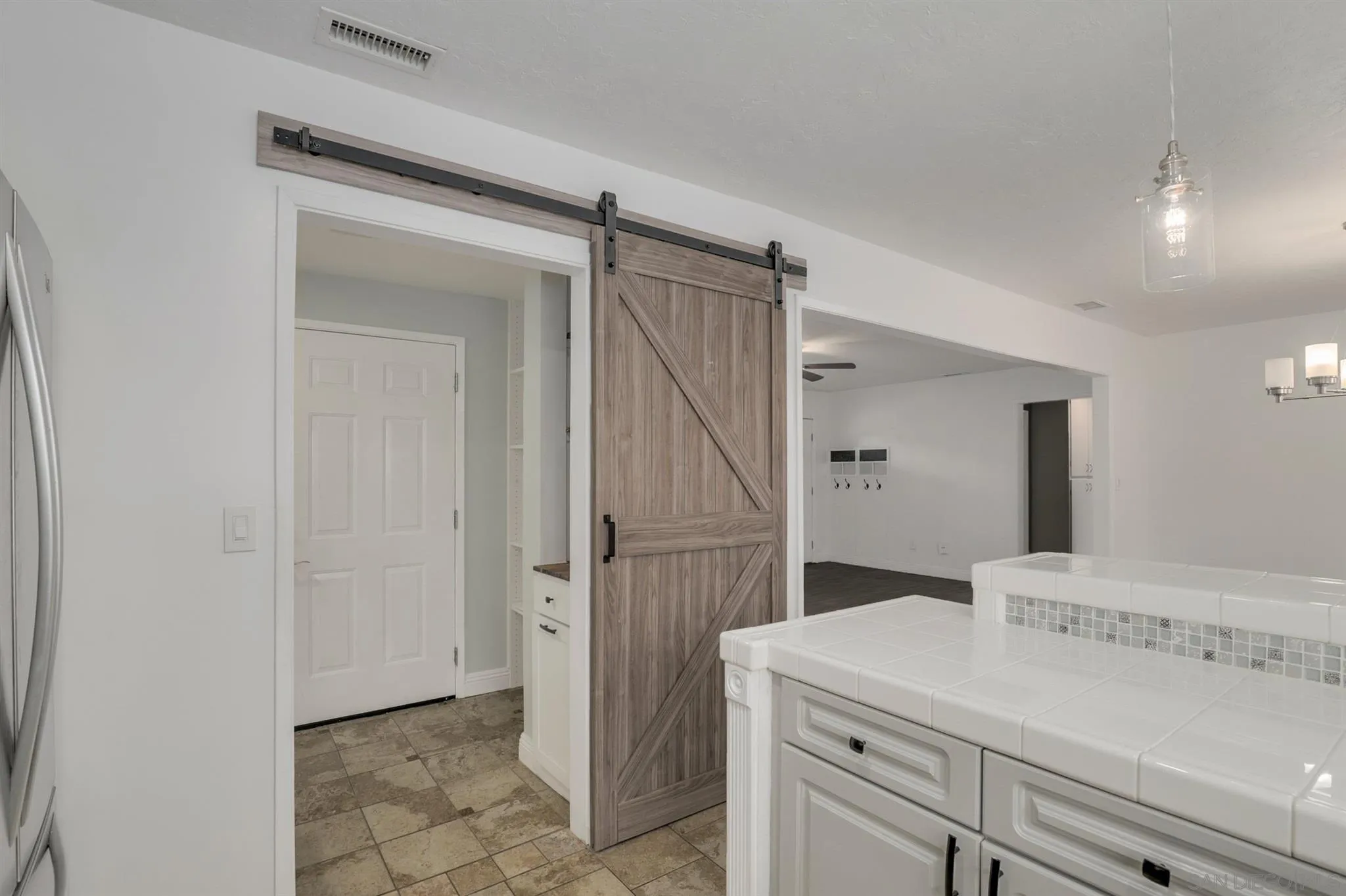 9753 Settle Road Santee, CA 92071 - Photo 6 of 31 a view of a hallway to closet and wooden floor