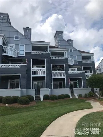 a view of a building with a yard