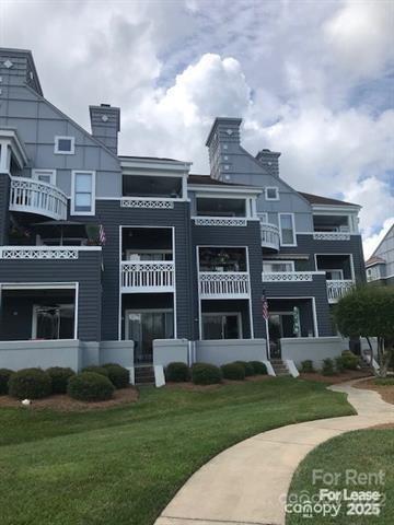 a view of a building with a yard