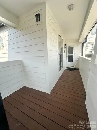 a view of wooden floor and a window