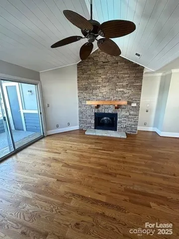 a room with fireplace and wooden floor