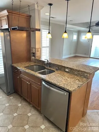 a kitchen with sink and window